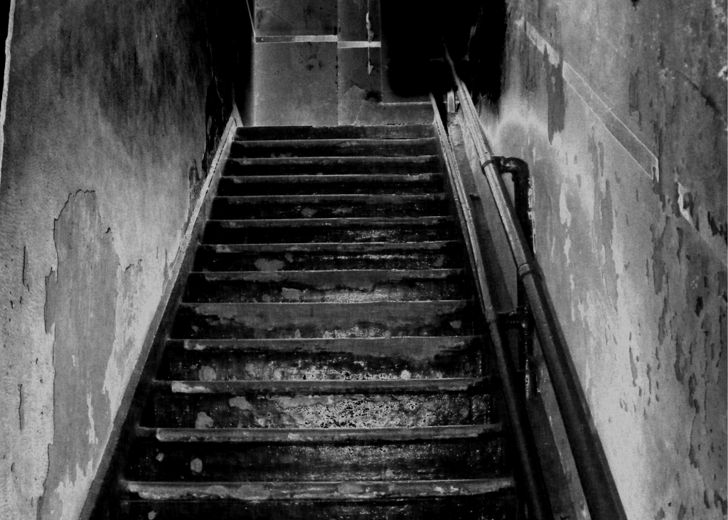 creepy stairwell leading to basement