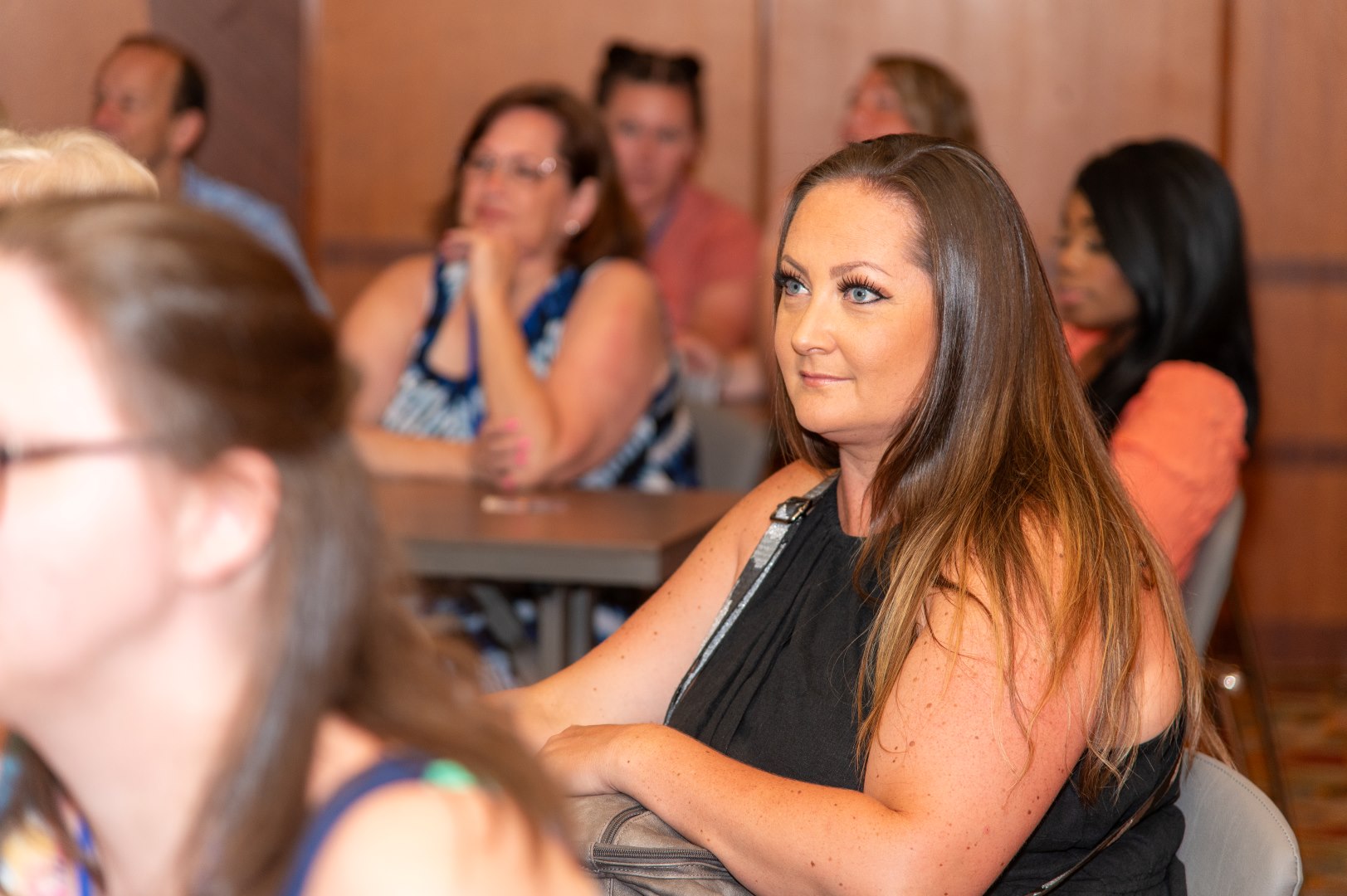 People sitting listening to a presenter