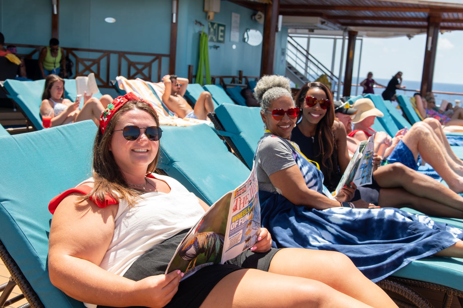 women lounging on cruise deck