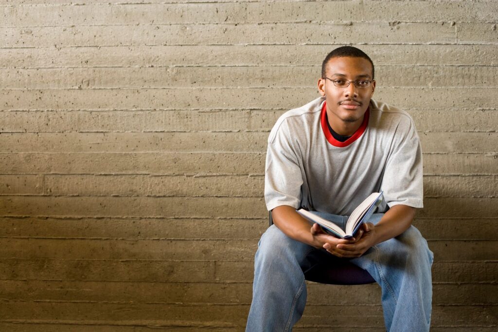 man sitting with a book